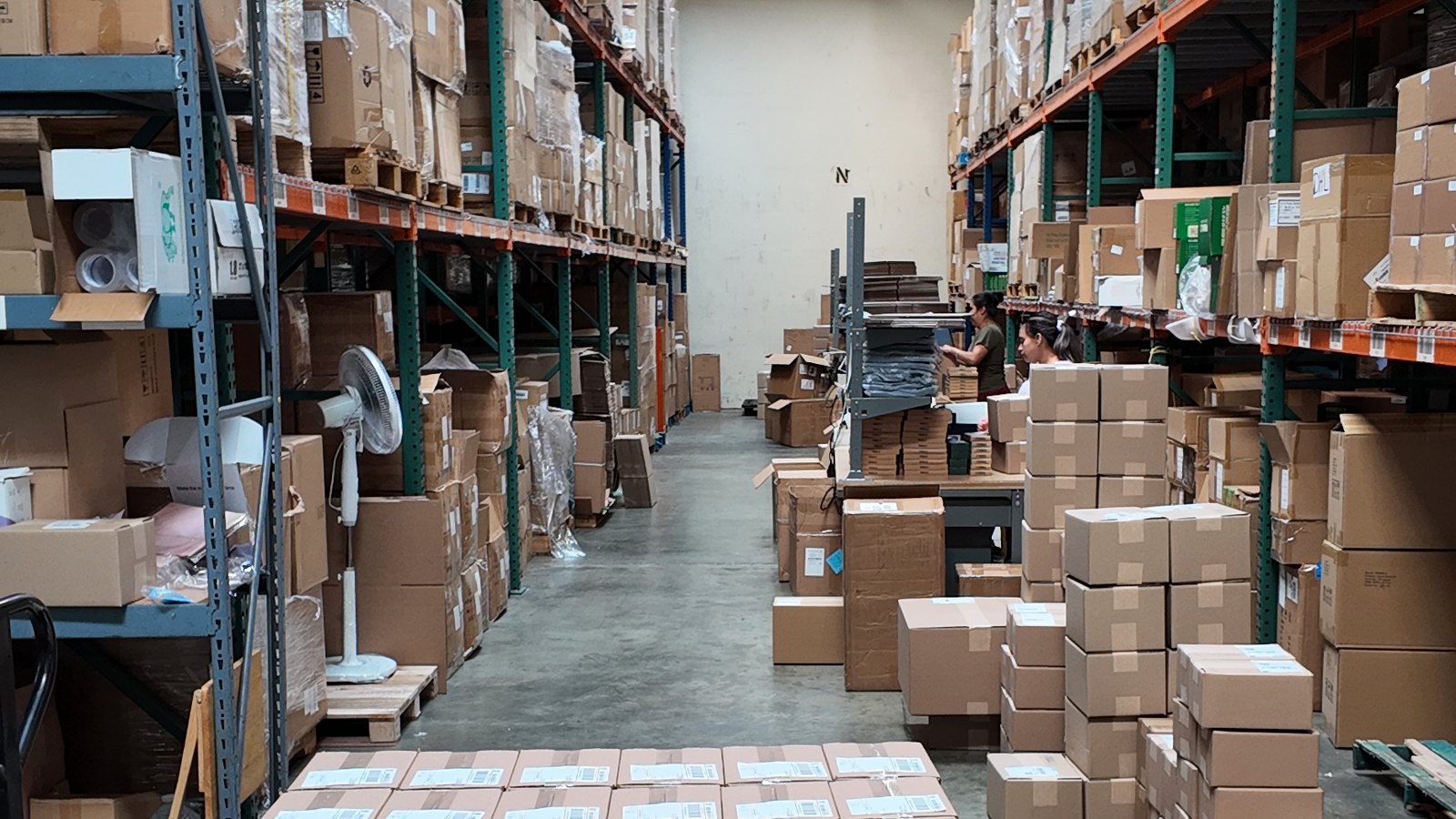 Fulfillment EZ warehouse aisle with pallet racking and packed cartons in Carson, California