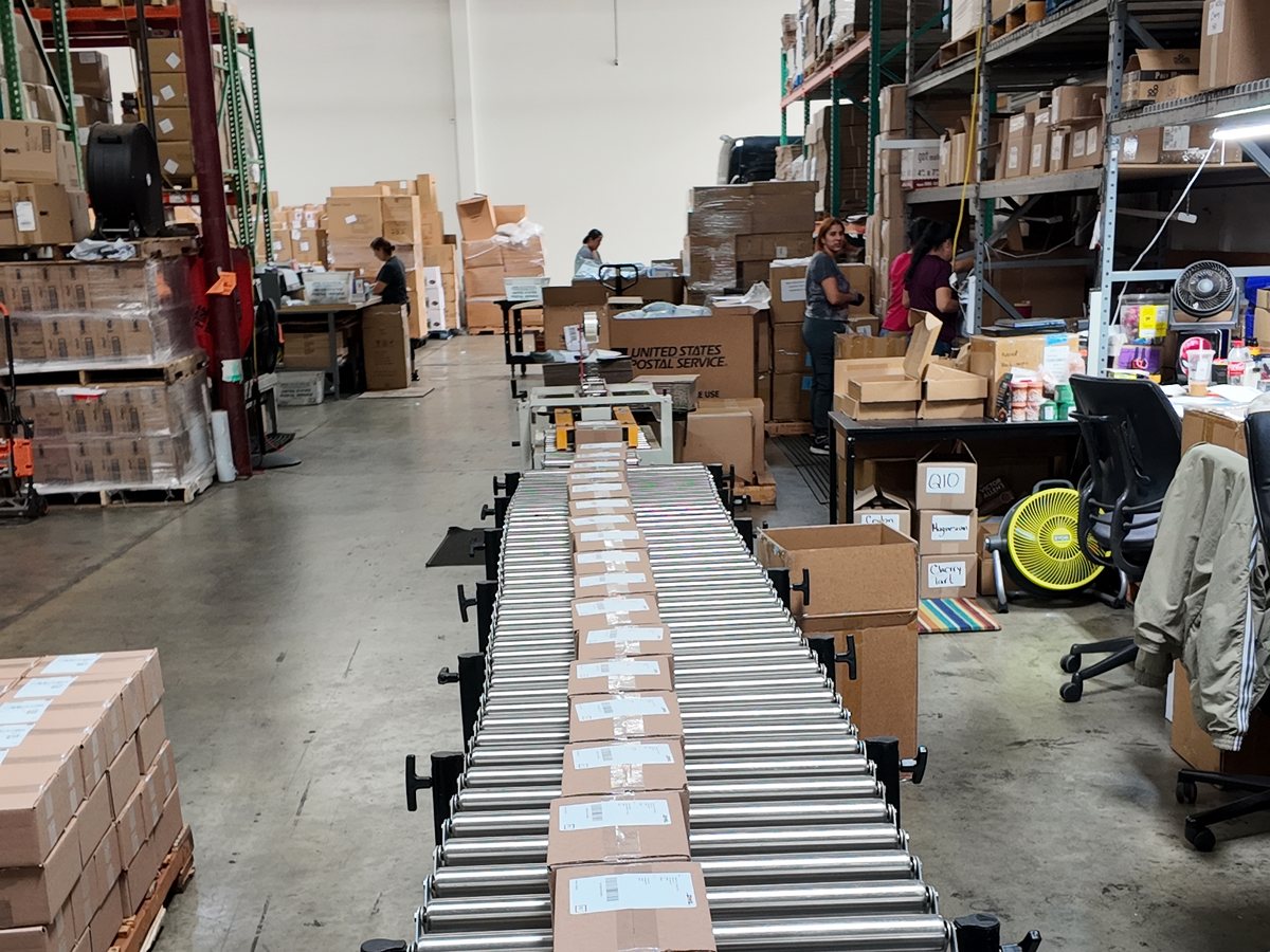 Packed cartons on the conveyor line in the Fulfillment EZ warehouse